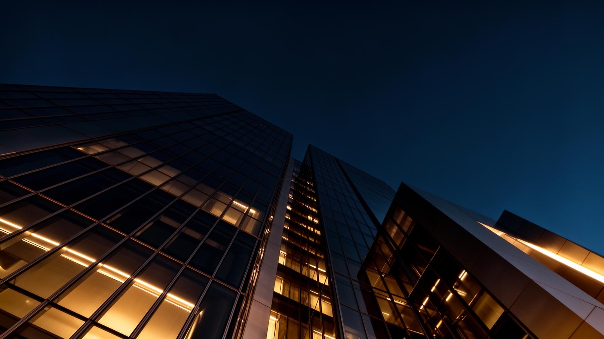Modern architectural facade at dusk symbolizing Springob Consulting Group's operational excellence